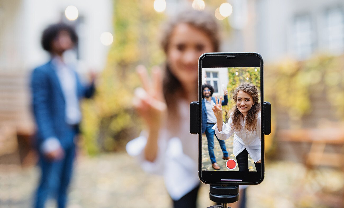 People recording video on cellphone