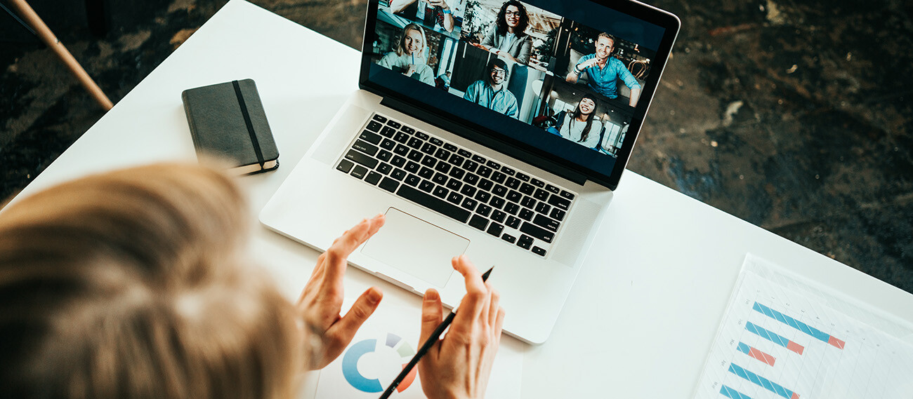 Person meeting with colleagues virtually