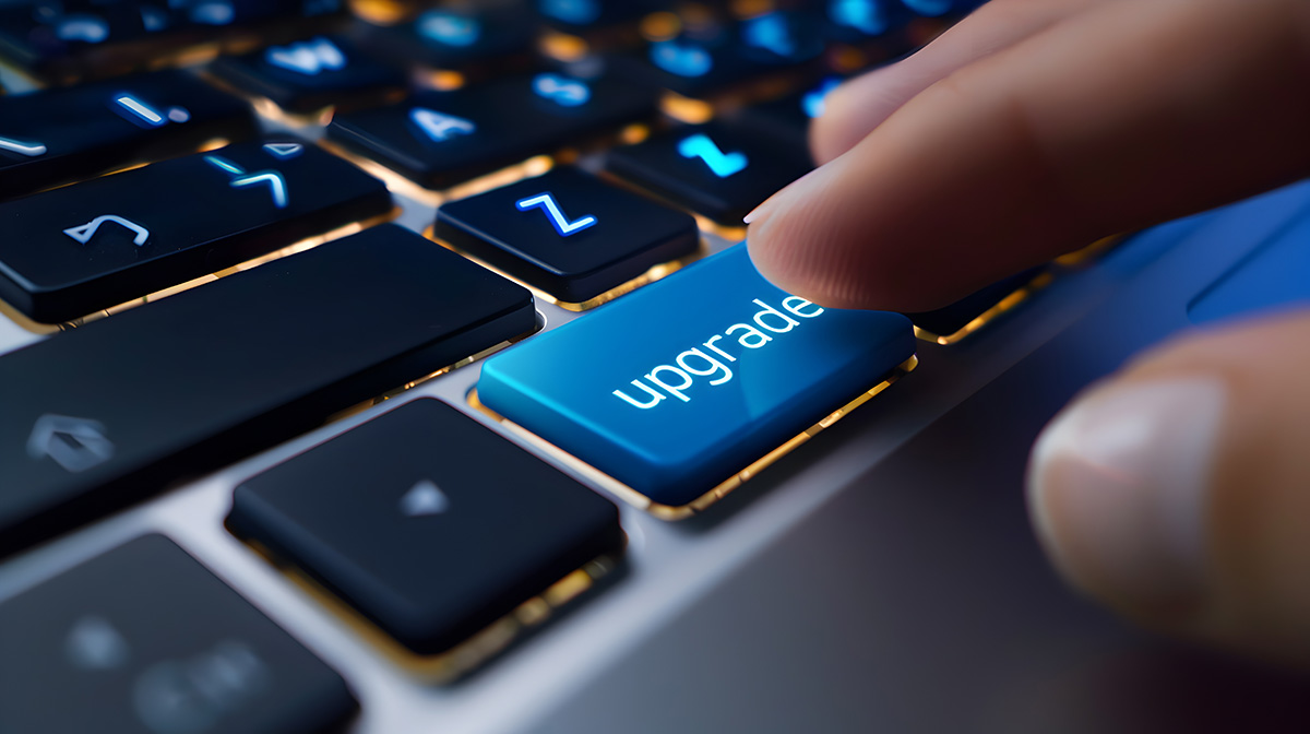 Finger pressing computer keyboard button that says 