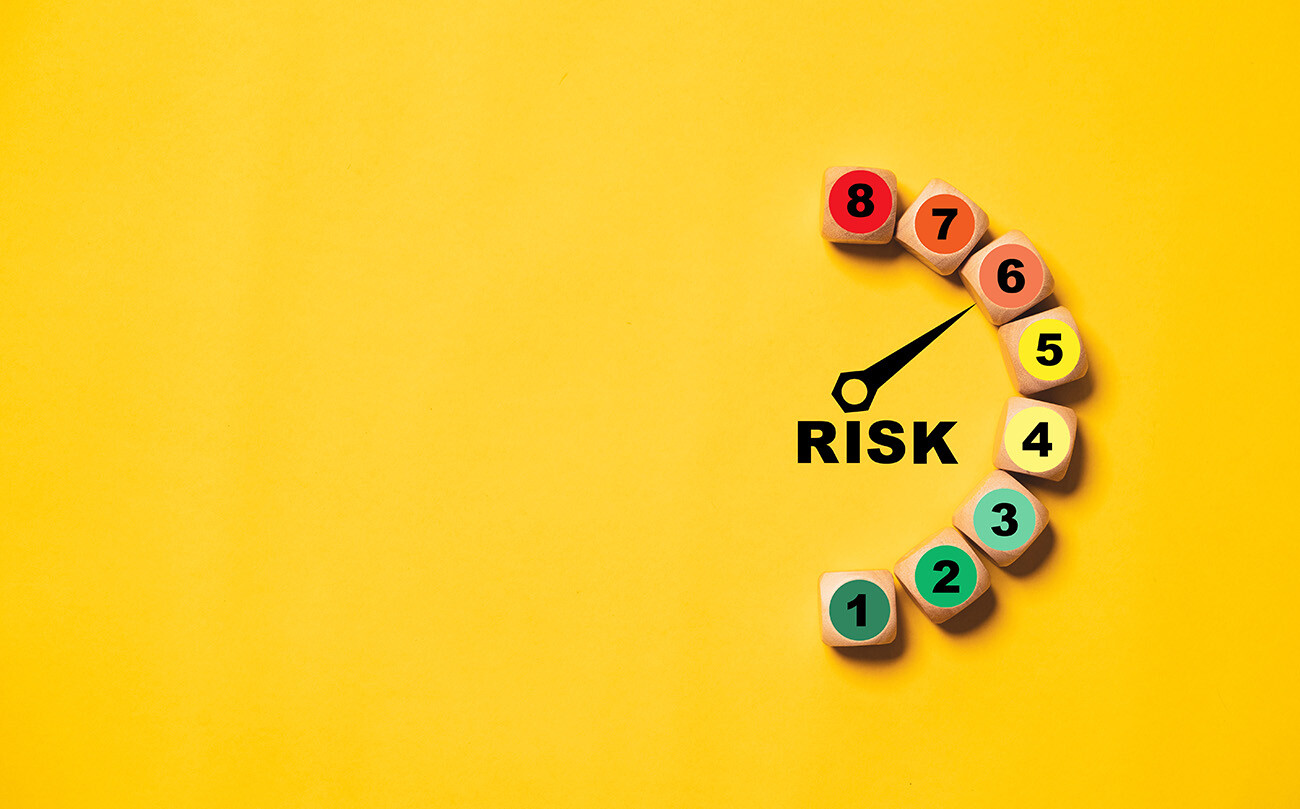 The word risk pointing to number 6 on a scale of 1-8